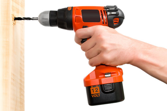 drilling a hole with a 12 volt electric drill